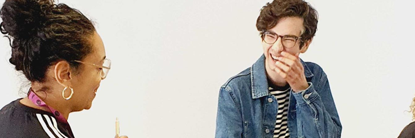 two people talking and laughing